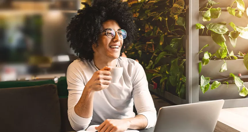Woman sitting at home working on laptop