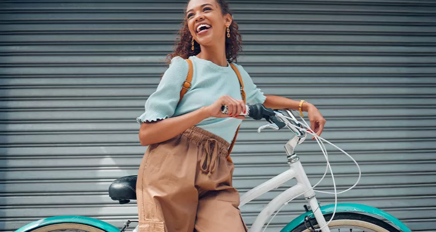 woman leaning against a bike