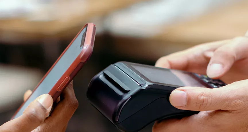 Person contactless paying using their phone