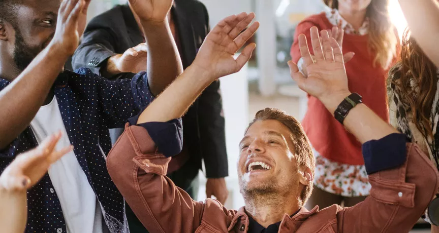 team celebrating at work