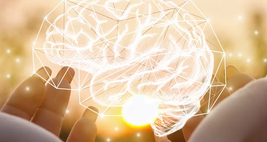 Holding an image of a brain made of lights