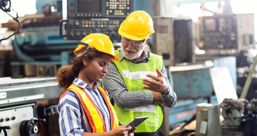 man and woman in a factory