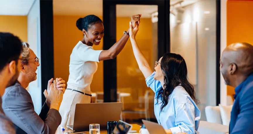Group of colleagues celebrating each other