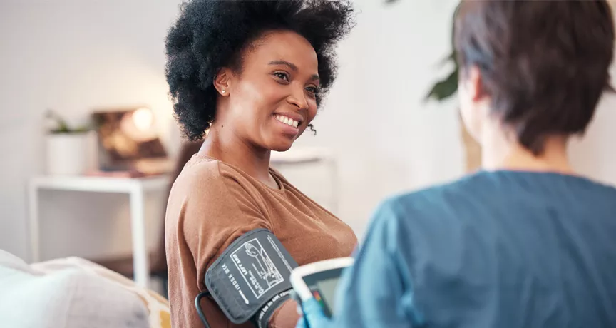woman having her blood pressure tested