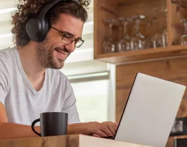 Man working at home and looking happy
