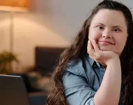 Neurodiverse girl sitting at a desk