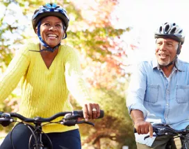 Man and woman riding on a bike