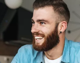 Happy man sitting at his desk