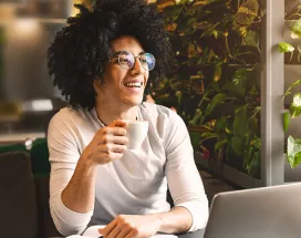 Woman sitting at home working on laptop