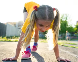 Young girl about to start a running race