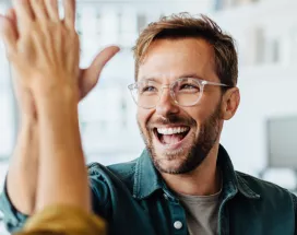 Happy employees giving each other a high five