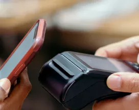 Person contactless paying using their phone