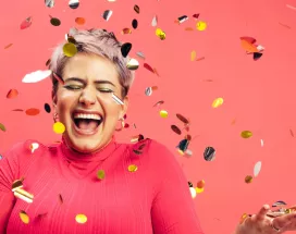 woman celebrating with glitter confetti