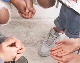 Group of people sitting in a circle talking