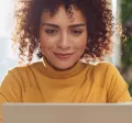 Happy woman on laptop