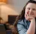 Neurodiverse girl sitting at a desk