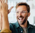 Happy employees giving each other a high five