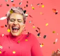 woman celebrating with glitter confetti