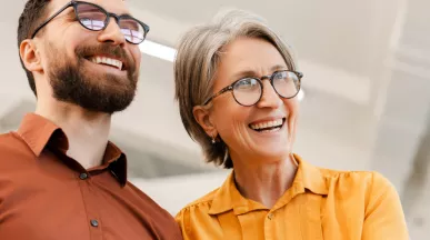 Older man and woman looking smart and smiling