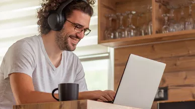 Man working at home and looking happy
