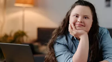 Neurodiverse girl sitting at a desk