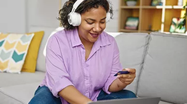 women purchasing something online with her card
