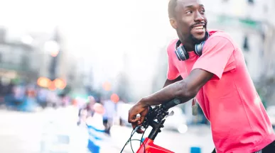 Black man on a bike