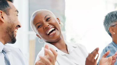 Group of happy employees clapping