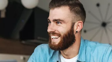 Happy man sitting at his desk