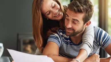 Man and woman checking their finances