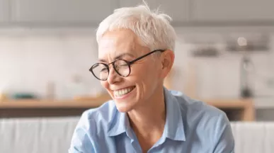 Happy older lady saving some money