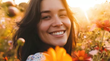 Woman in a field full of tall flowers
