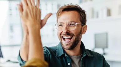 Happy employees giving each other a high five