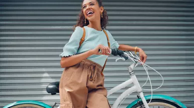 woman leaning against a bike