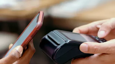 Person contactless paying using their phone