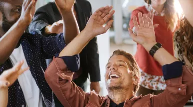 team celebrating at work