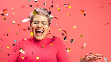 woman celebrating with glitter confetti