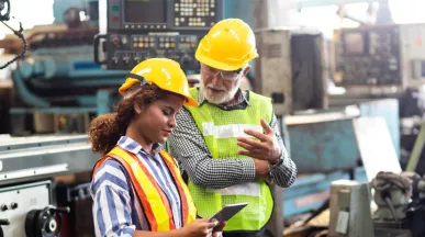 man and woman in a factory