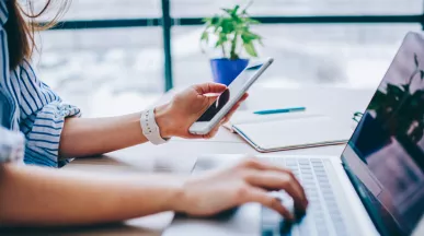 blog upload - woman on phone and laptop
