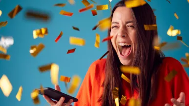 woman celebrating with gold confetti everywhere