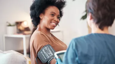 woman having her blood pressure tested