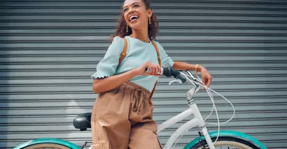 woman leaning against a bike