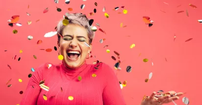woman celebrating with glitter confetti